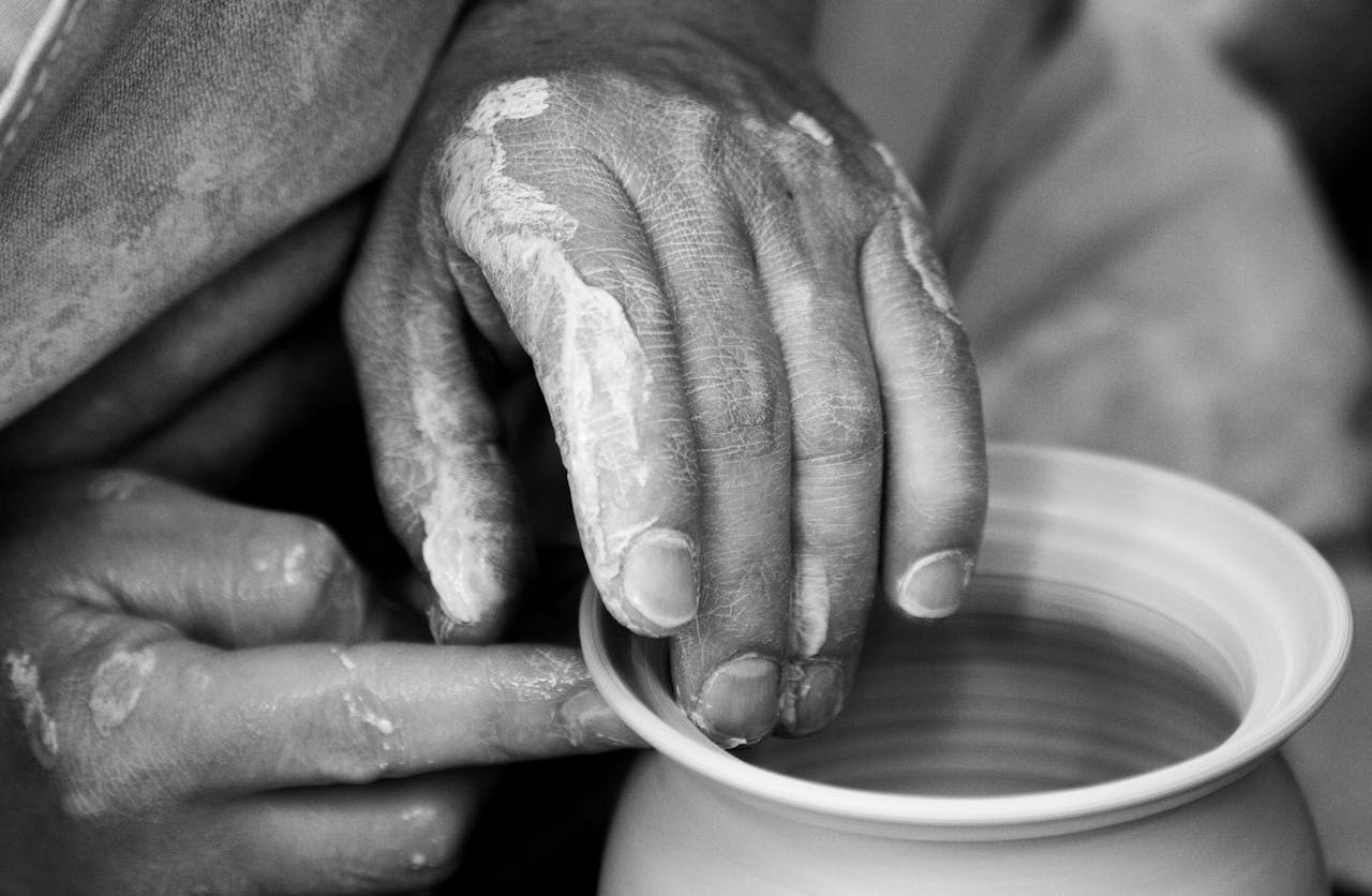 Person Forming Clay Pot